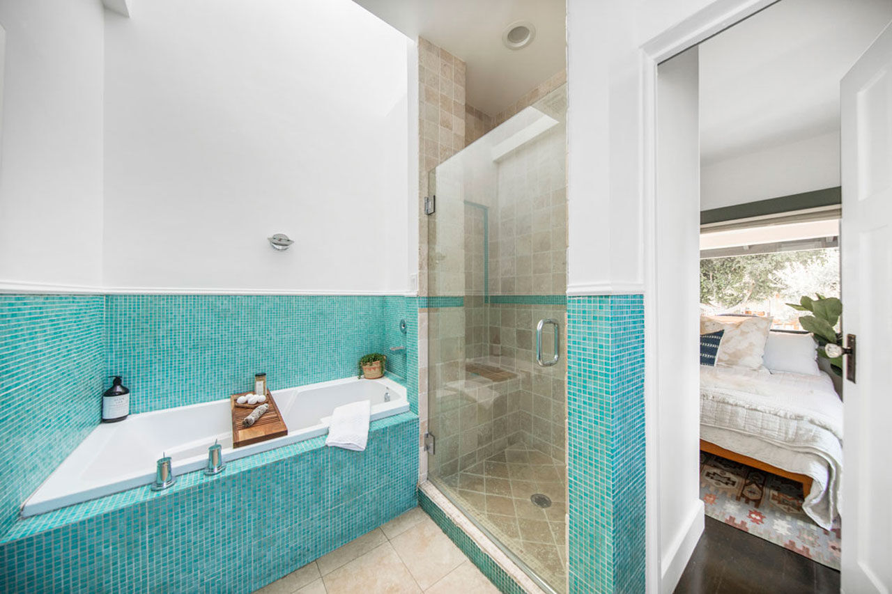 Tub and shower in bathroom 5325 Buchanan St